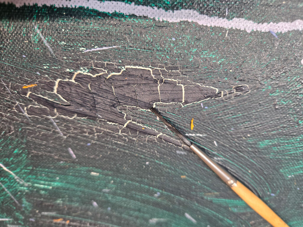 A detail of Joan Mitchell's large abstract painting "Close" that shows where paint is cracking and flaking