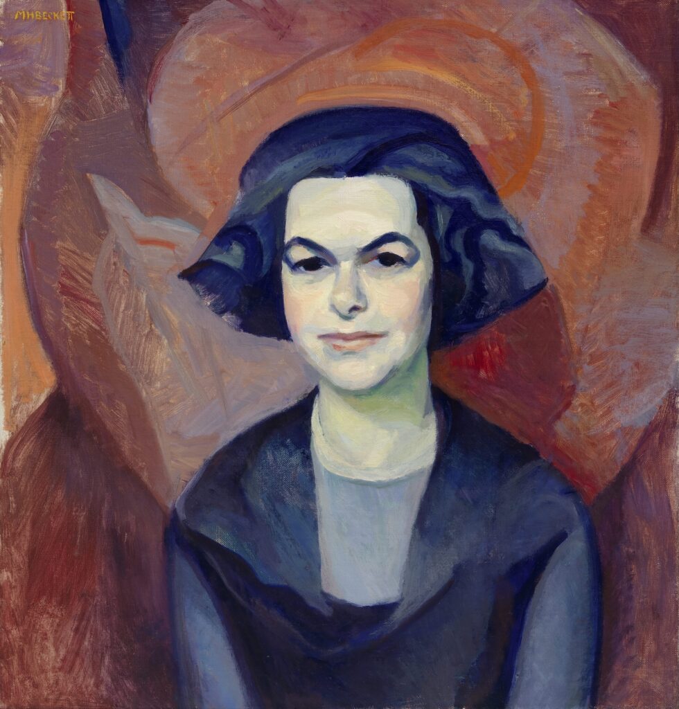Marion H. Beckett's portrait of playwright and producer Theresa Helburn. She's seen about half length, her dark hair cut in a sharp bob. She wears dark clothing, which stands out against her pale skin, and she is posed in front of an abstracted background in tones of red.