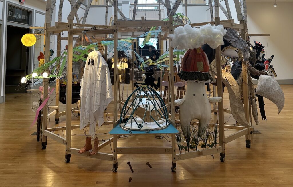 Martijn van Wagtendonk's "Cupola: A Collaboration," on view at the Lyndon House Arts Center in Athens, a wooden structure of puppets and bells that moves and plays music when you insert a quarter.