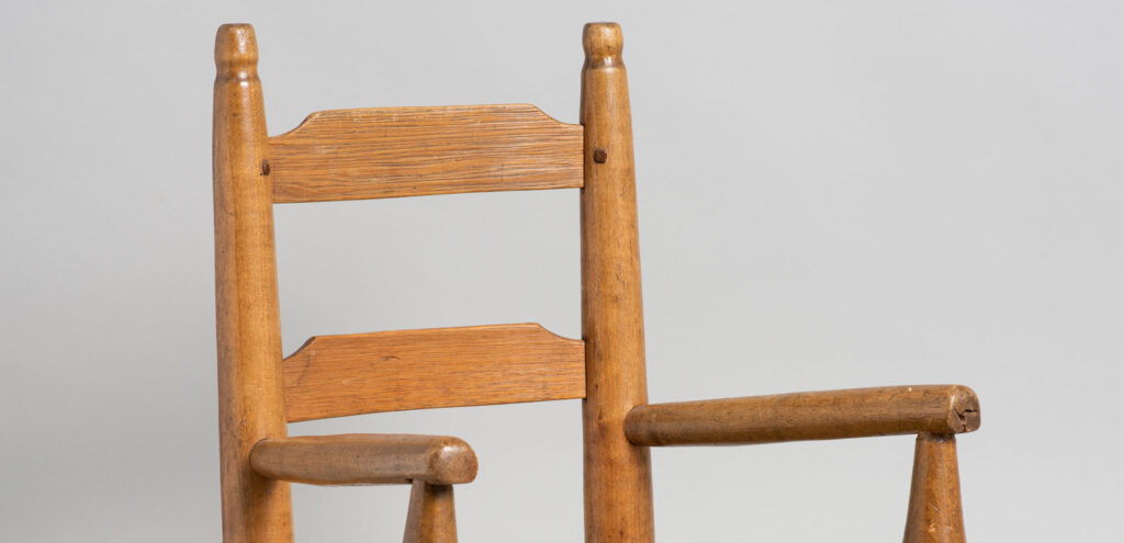 A detail of a child’s arm chair dating ca. 1840–80