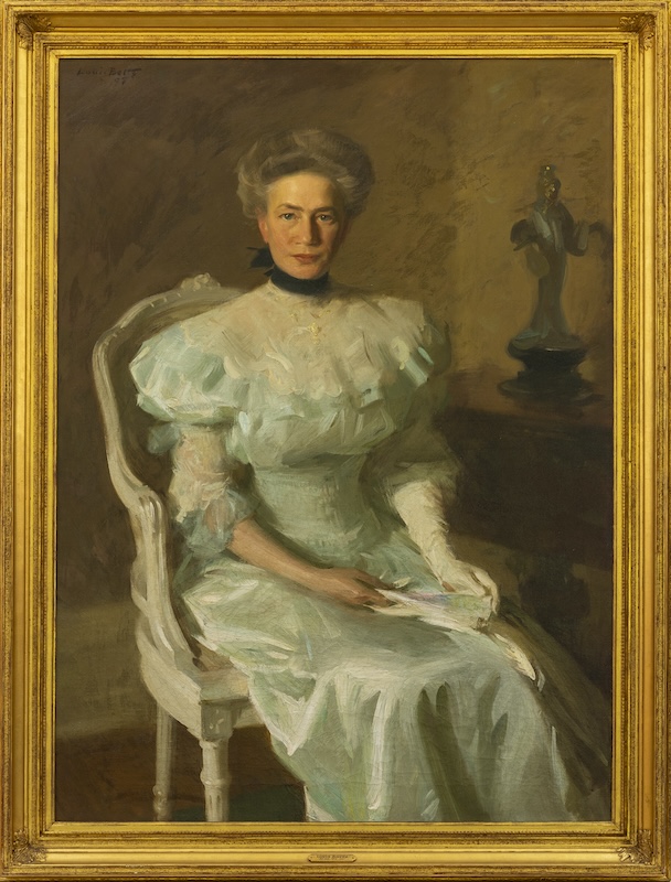 Portrait of a woman from the late Victorian era wearing a light blue gown 