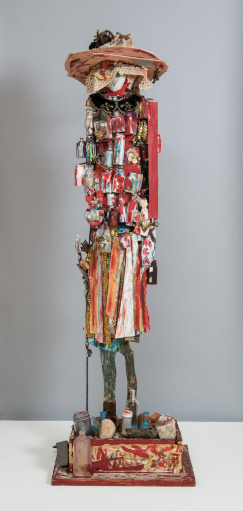 Beverly Buchanan's "Medicine Woman," a spindly sculpture made of found materials (including medicine bottles) that seems to show a woman in a dress, wearing a broad-brimmed hat and leaning on a cane.