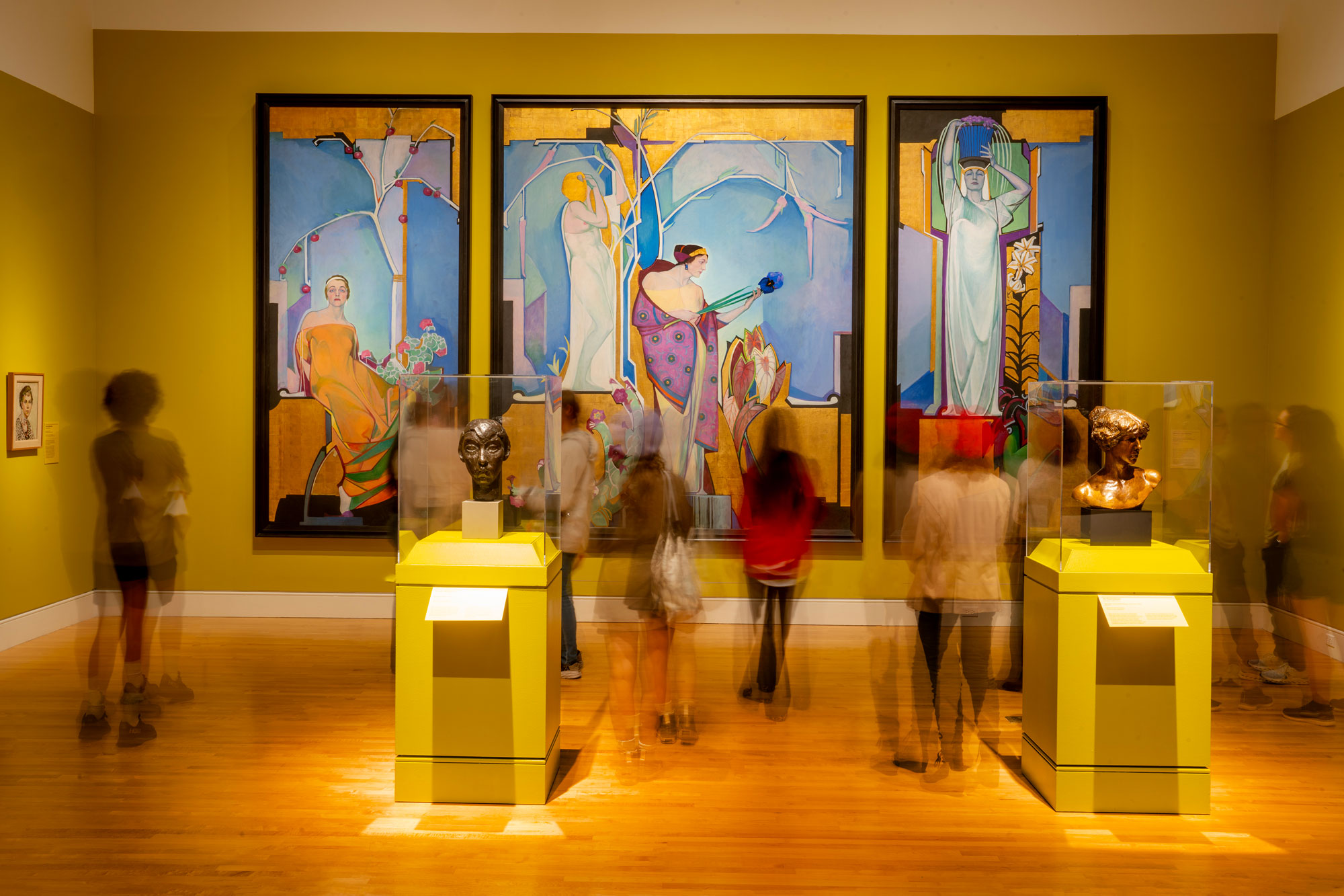 A photograph by Jason Thrasher of people visiting the exhibition "Brilliant Exiles" at the Georgia Museum of Art
