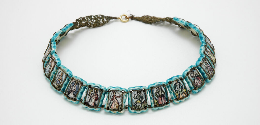 Alice Fischer's necklace "The History of Fashion," featuring individual hand-crafted beads that show different forms of dress