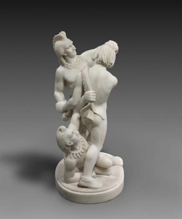 Edmonia Lewis' sculpture "Indian Combat," which features three Native American men in a fight. One lies on the ground, between the legs of one of the two standing figures.