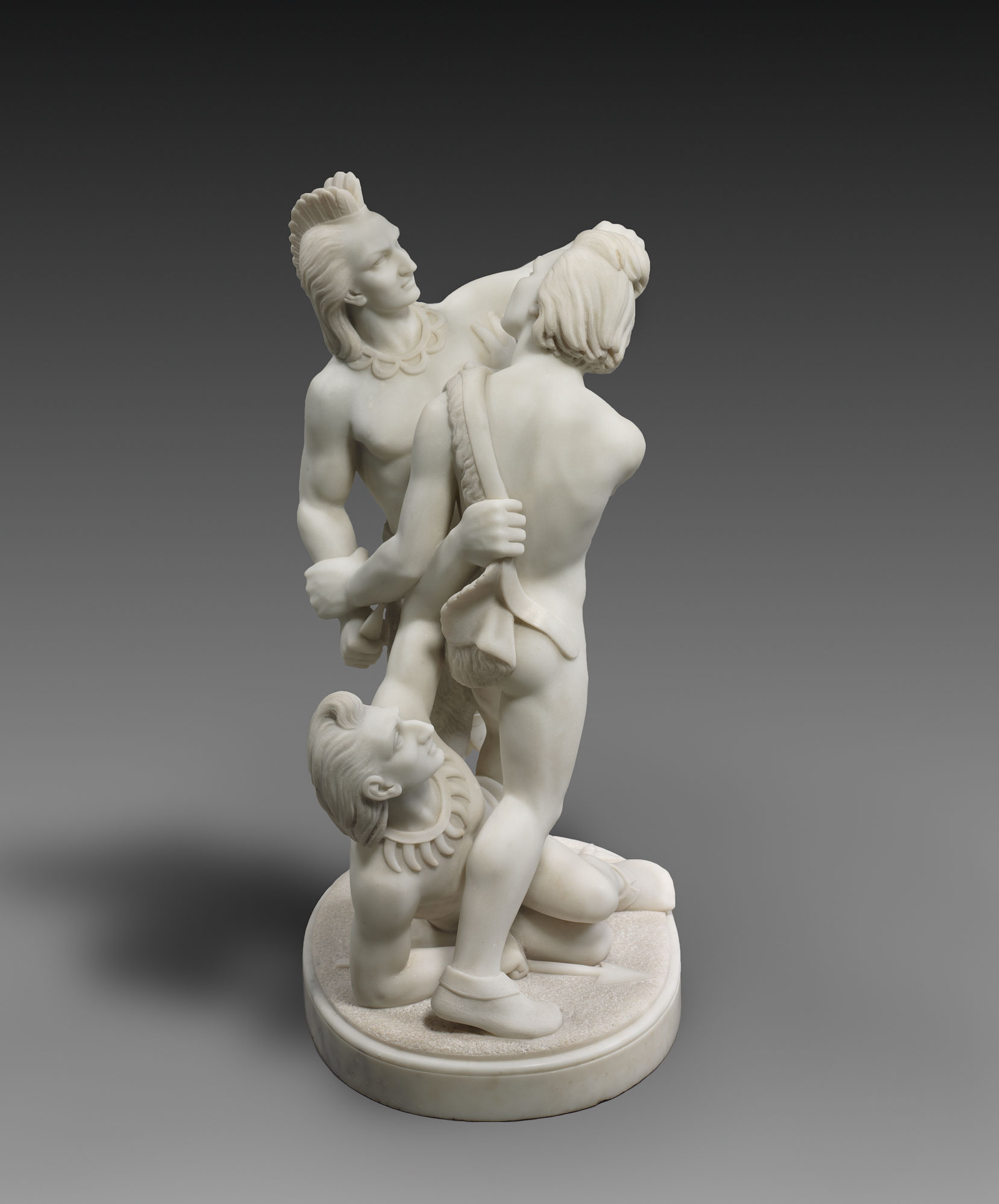Edmonia Lewis' sculpture "Indian Combat," which features three Native American men in a fight. One lies on the ground, between the legs of one of the two standing figures.