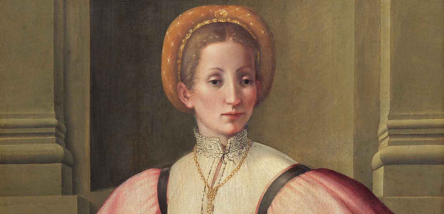 A detail of a portrait of a woman by Pier Francesco Foschi. She wears a pink gown, is seated and faces the viewer's right, and holds a book in her lap with her fingers marking a place in the pages.