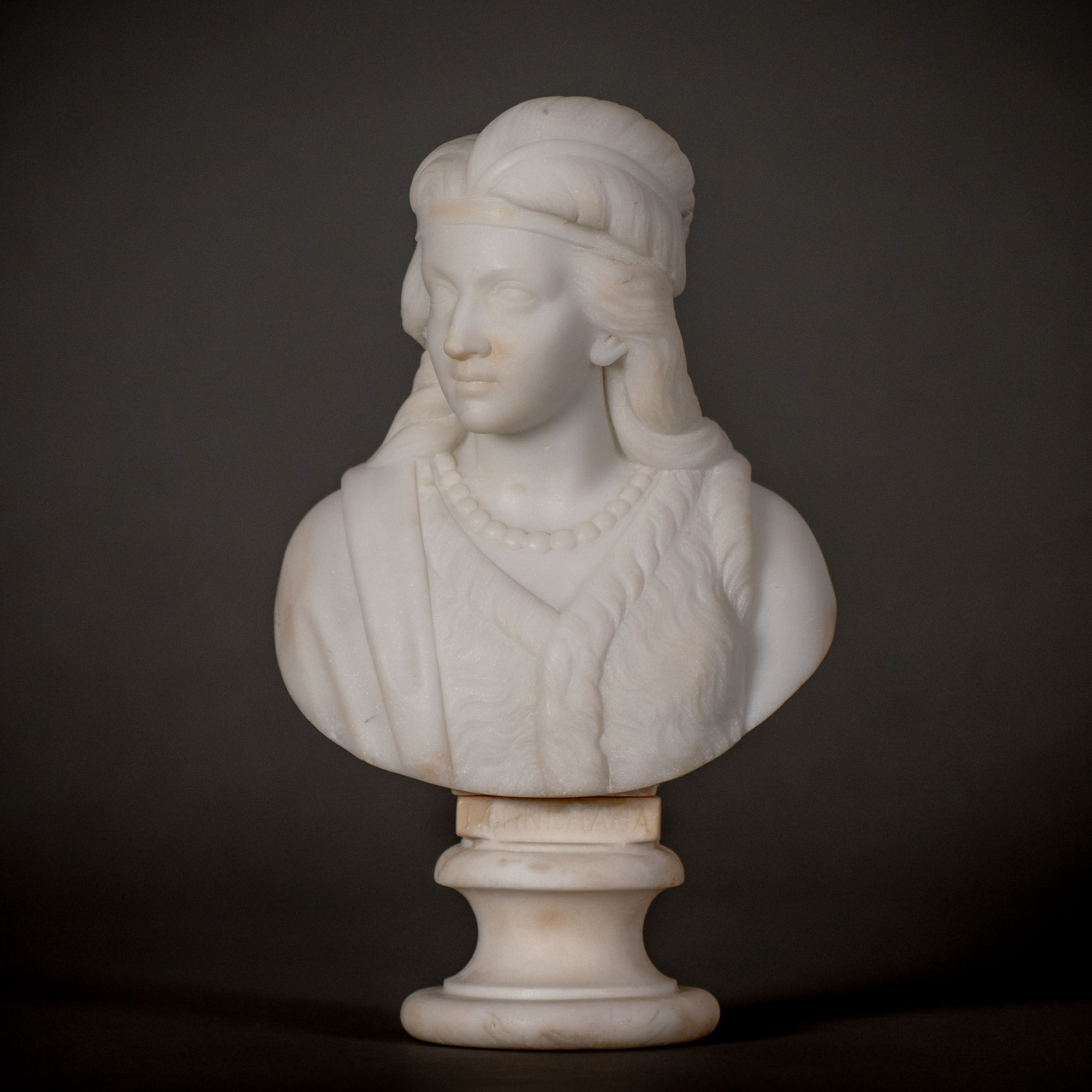 Edmonia Lewis' "Minnehaha," a small bust-length white marble sculpture of the bride of Hiawatha in Henry Wadsworth Longfellow's poem "The Song of Hiawatha"