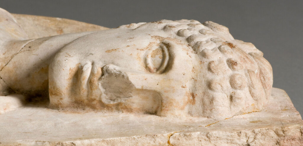 A detail of a relief sculpture of Hermes