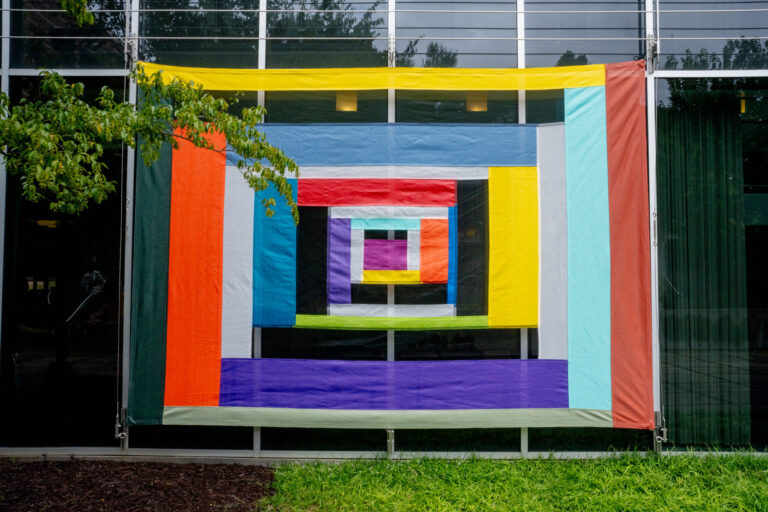 Installation photograph of “Looking Through a Sewn Sky: Rachel Hayes” by Jason Thrasher.