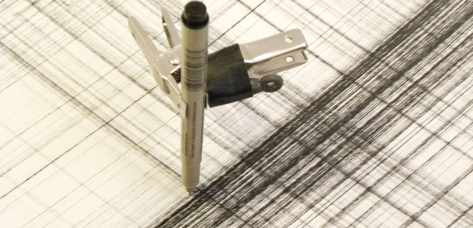 A close-up photo of Tristan Perich's "Machine Wall Drawing" at work