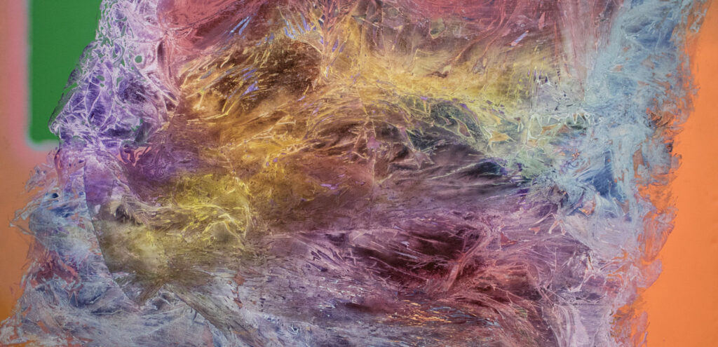 A large, colorful abstract painting by Gary Hudson that features swirling, translucent waves of color that overlap and intersect in the center, and simpler planes of flatter color around the edges