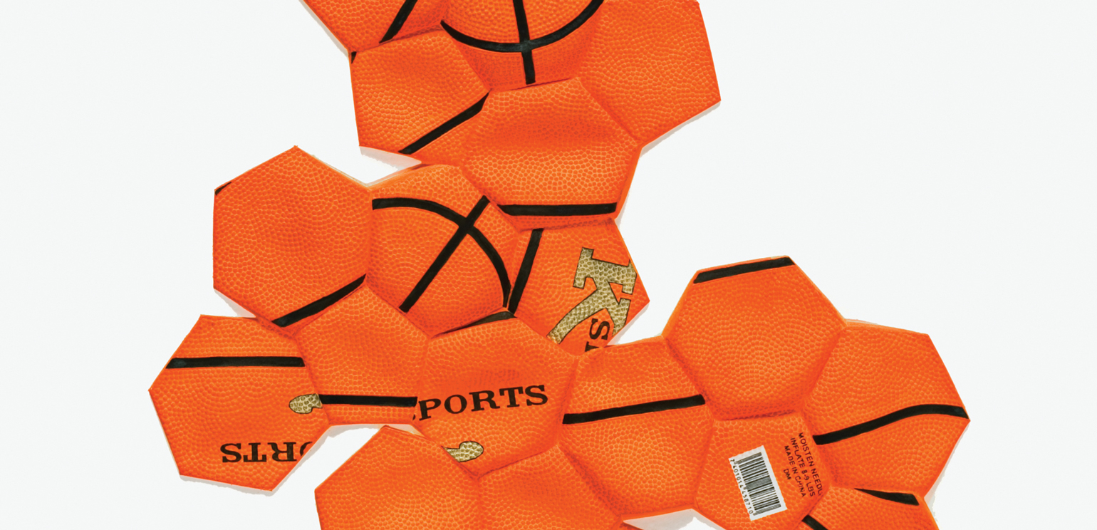 A detail of a Mixografia 3D relief print that looks like a basketball separated into hexagons and spread out