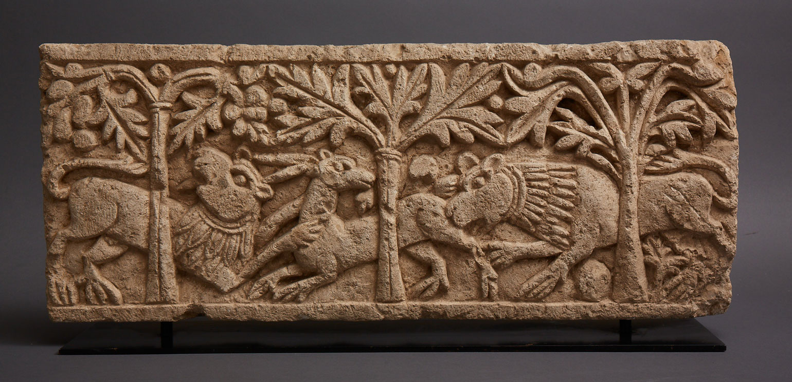 A limestone relief from the 3rd century CE that shows lions attacking a goat.