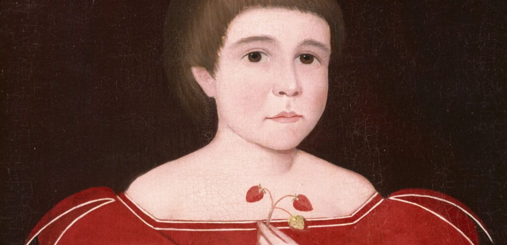 Detail of an Ammi Phillips painting of a young boy in a red dress, holding a small gavel and a spray of strawberries