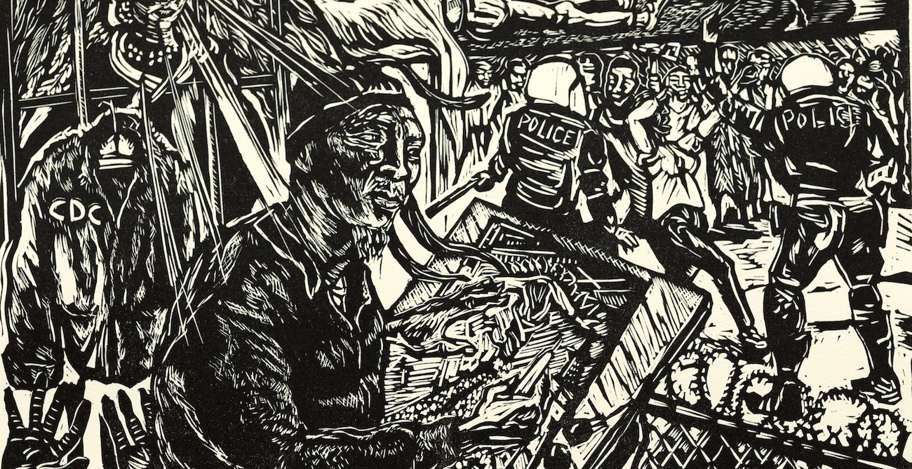 Portrait of Ronnie Goodman working on a linocut