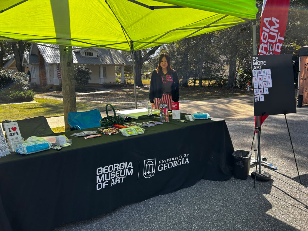Hanxu Chen works a tabling opportunity for the Georgia Museum of Art