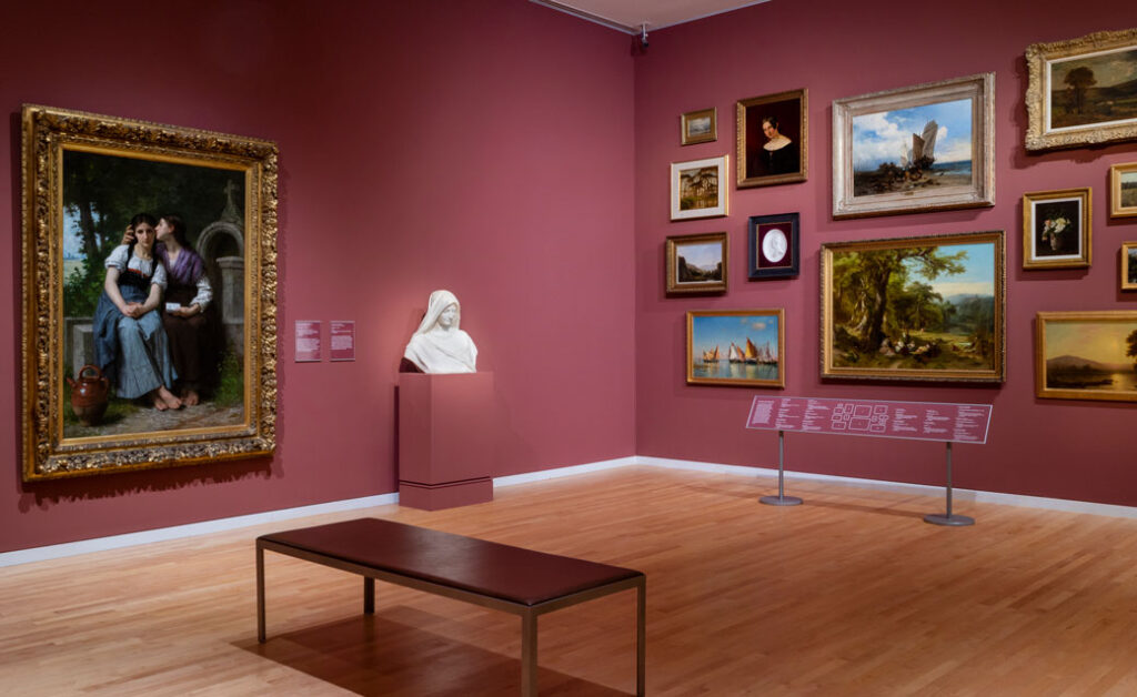 Paintings hung salon style in the museum's permanent collection