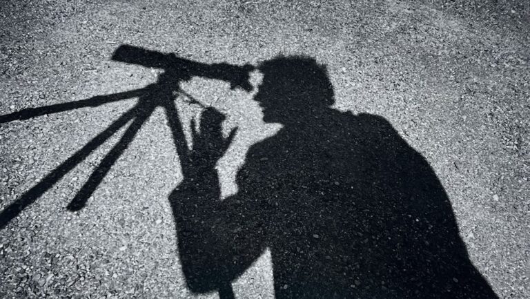Arthur Tress' photograph depicts the shadow of a man looking into a telescope