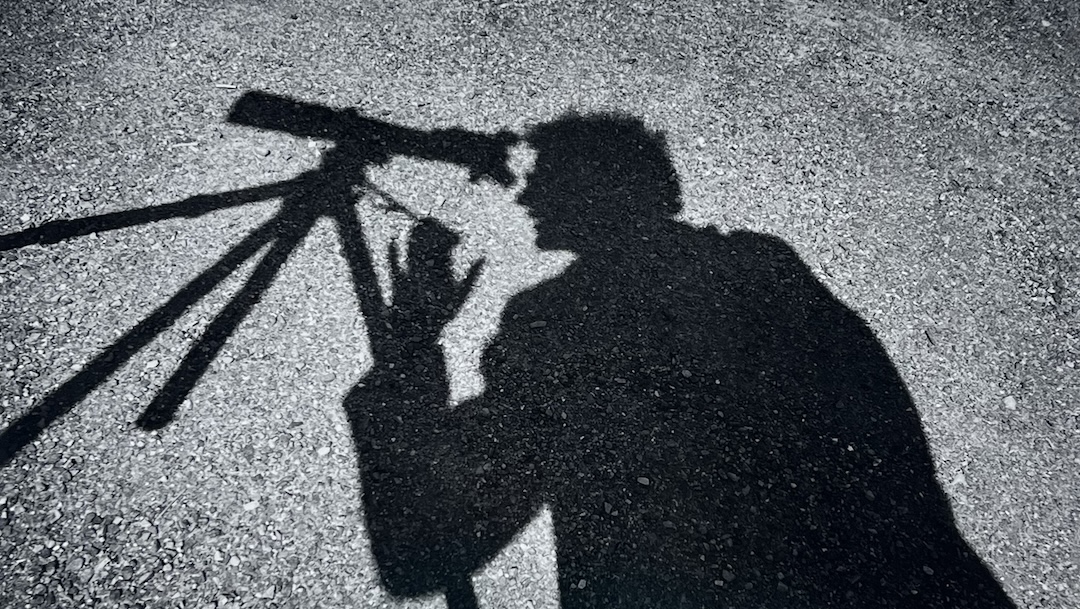 Arthur Tress' photograph depicts the shadow of a man looking into a telescope
