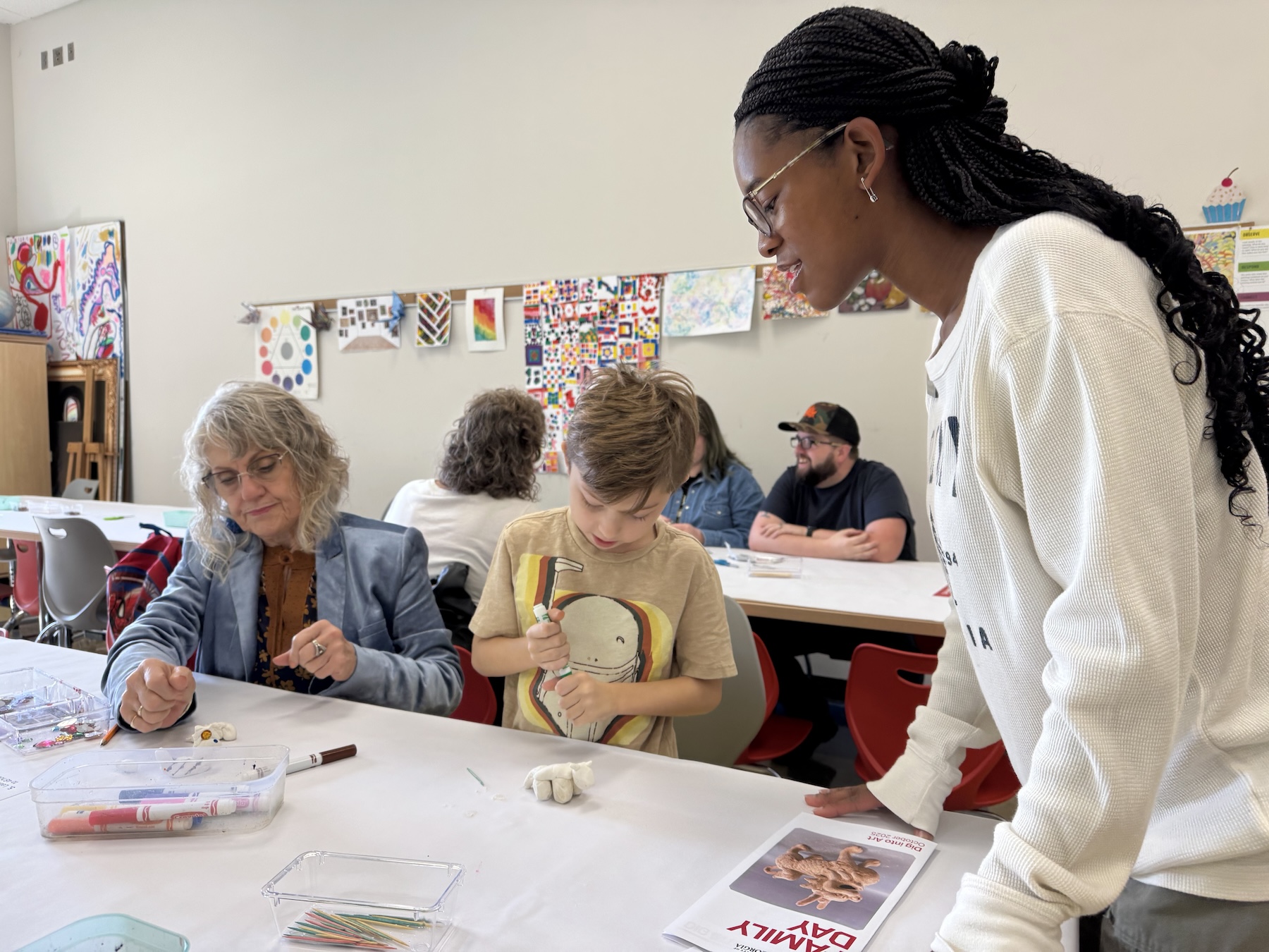 Student gallery teacher Samaya Porter leads an activity making clay animals in the museum’s classroom.