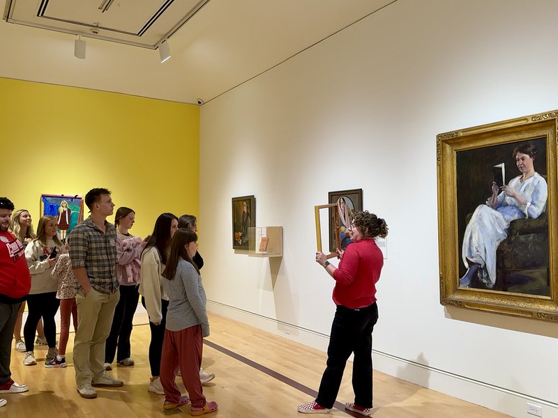 Mallory Lind leads a gallery tour