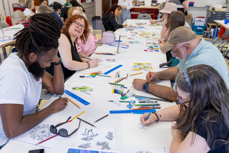 People drawing mandalas in the museum’s studio classroom during Sunday Slowdown