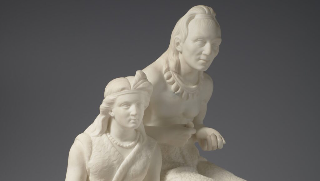 A detail of Edmonia Lewis' marble sculpture "The Old Indian Arrow Maker and His Daughter" shows two characters from Henry Wadsworth Longfellow's poem "The Song of Hiawatha."