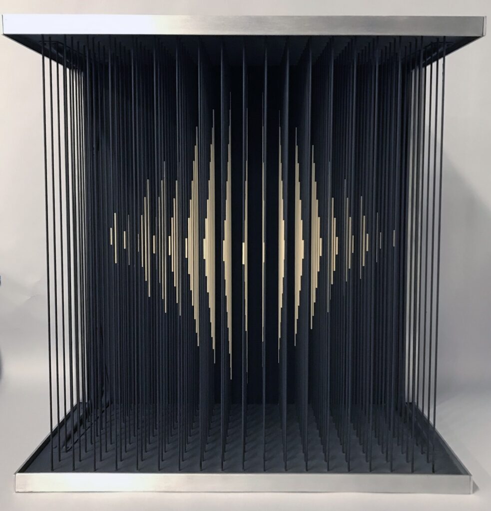 Yvaral's sculpture "Instability Number 18" is a square shaped work made up of rows of thin cords. The cords are painted to create an optical illusion of a four-sided pyramid that comes into focus based on the viewer's position.