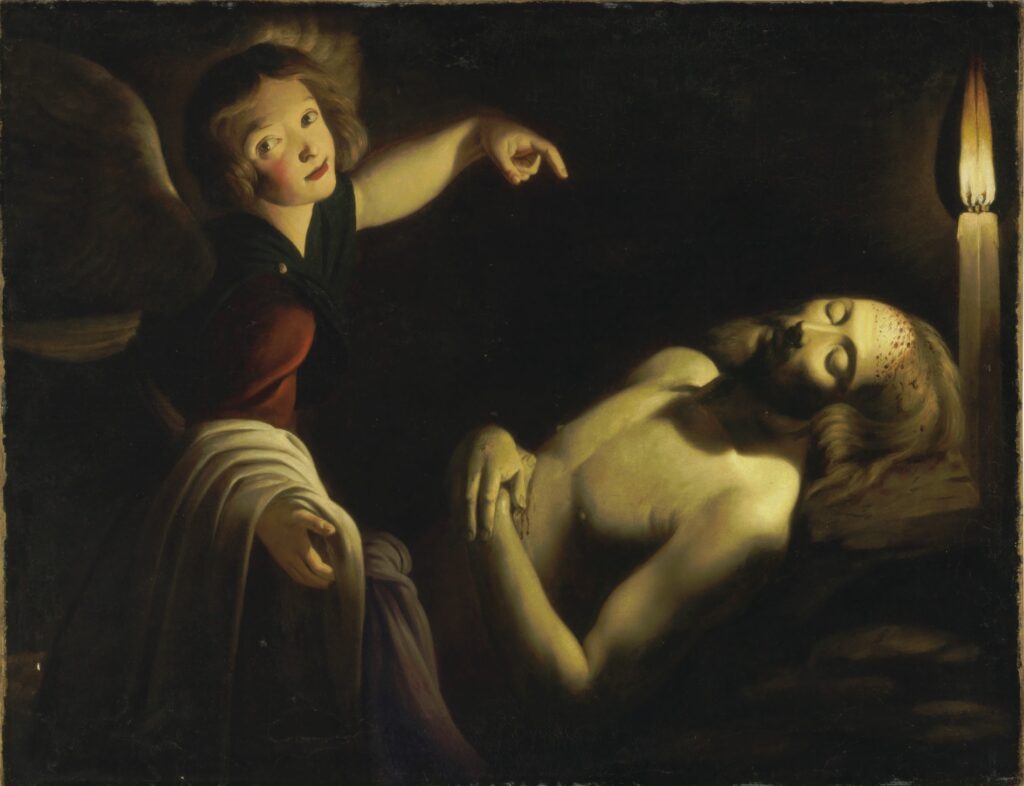Trophime Bigot’s “Angel Watching Over the Dead Christ" is a very dark scene lit by a candle's flame. An angel on the left side points down at Jesus, who is dead. There are small drops of blood across his forehead from his crown of thorns, and his arms are folded across his torso, where he has another injury.